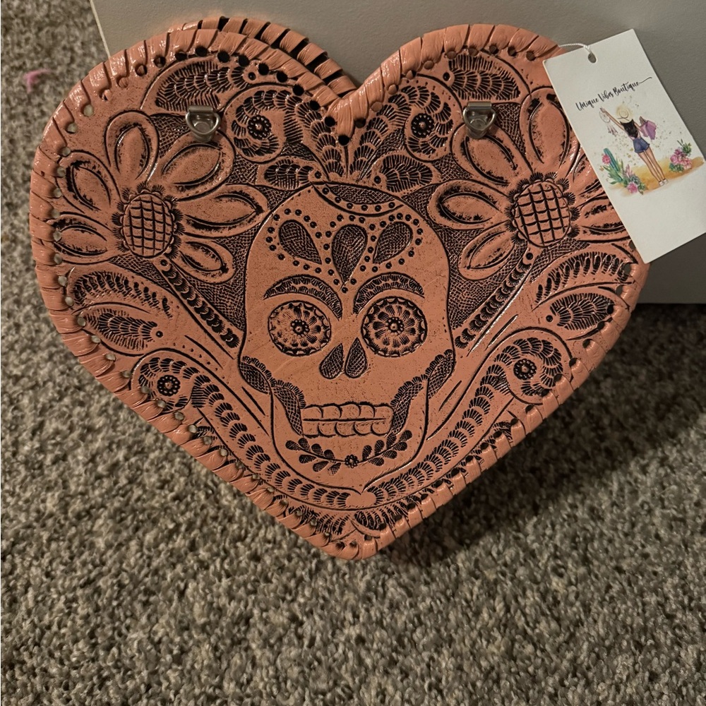 Heart-Shaped Leather Bag with Skull Design